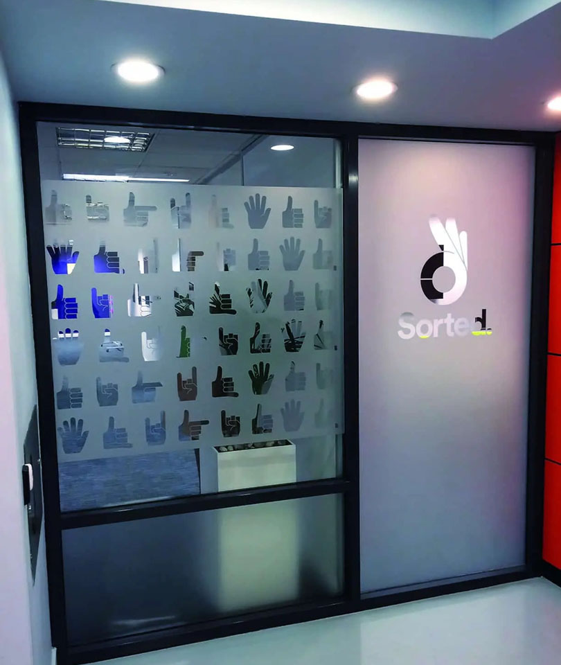 Cut vinyl applied to a window as a visual manifestation to add interest to a full-height window.