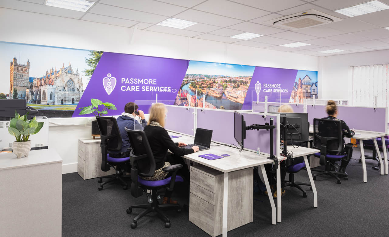 Impactful wall graphics give a lift to white walls in an office setting.