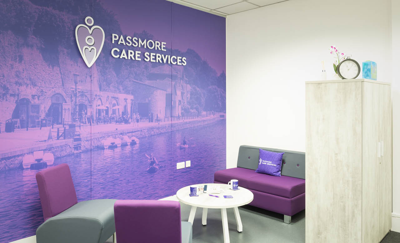 Wall graphics, printed pens and cushions as Passmore's breakout space at their new Exeter office.