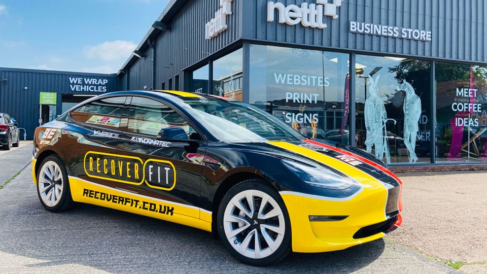 A Tesla vehicle wrap for Recover Fit an Exeter based fitness company. The logo and design of the wrap was completed by our Exeter team.