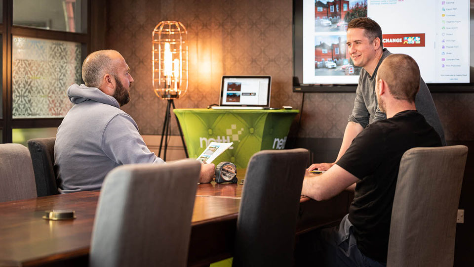 The Nettl of Exeter signage team discussing an installation at Burleigh Hub in our conference Meeting Room