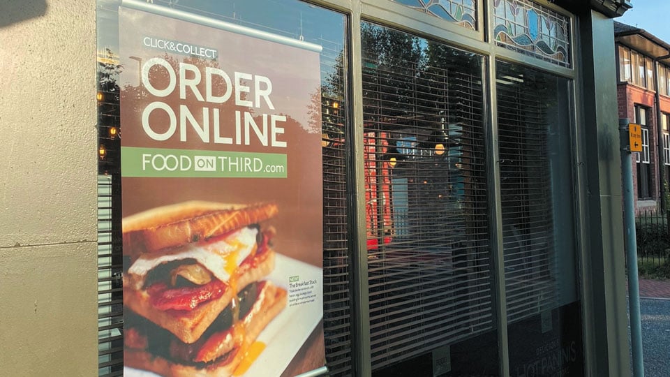 Food on the Third poster restaurant adverting the online ordering with a large print.