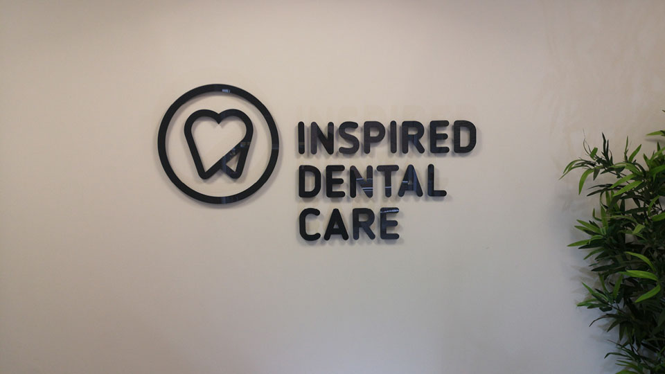 Wall signage for Inspired Dental Care installed and designed by the Nettl team in Exeter.