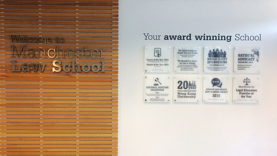Indoor signage for Manchester Law School with print onto acrylic and standoffs to give a 3D effect.