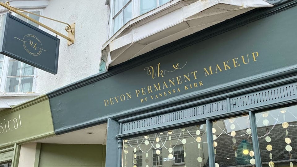 A close of up of the wonderfully designed Devon Permanent Makeup store front which has a new shop sign courtesy of Nettl of Exeter.